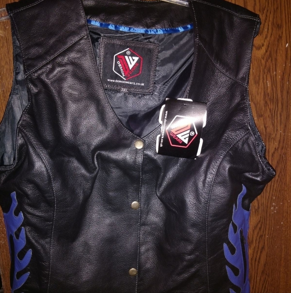 mark. Black and Blue Leather Vest